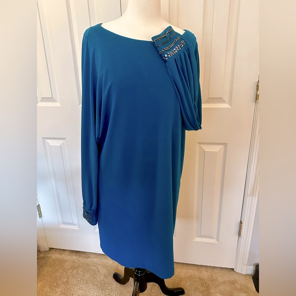 Beautiful Blue S.L. Fashions Dress with Copper jewels cuffs, shoulder slits.